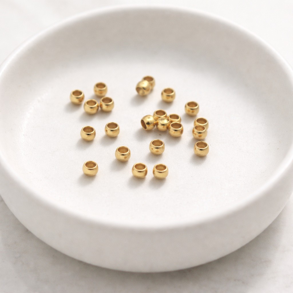 20 Edelstahl Quetschperlen goldfarben 3 x 2 mm