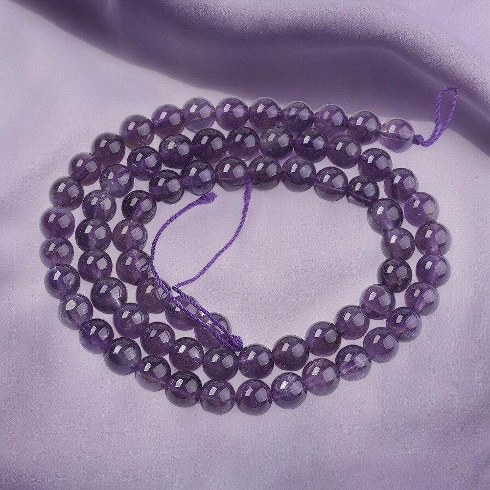 Amethyst Perlenstrang 6 - 6,2 mm Klasse AB rund (ca. 66 Perlen / ca. 38 cm Länge)