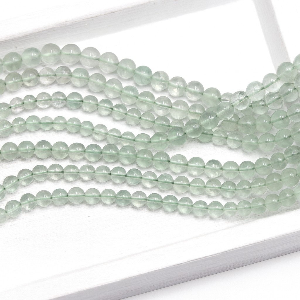 Fluorit Perlenstrang 4 - 5 mm unregelmäßige runde Perlen (ca. 34 cm Länge)