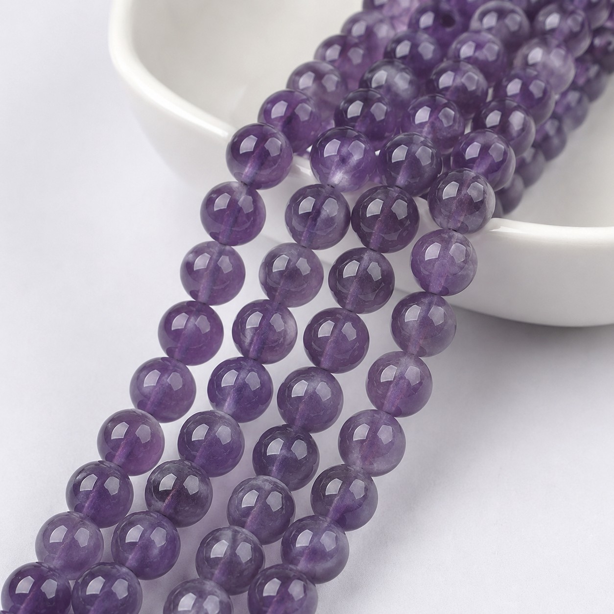 Amethyst Perlenstrang 6 - 6,5 mm Klasse AB rund (ca. 66 Perlen / ca. 38 cm Länge)