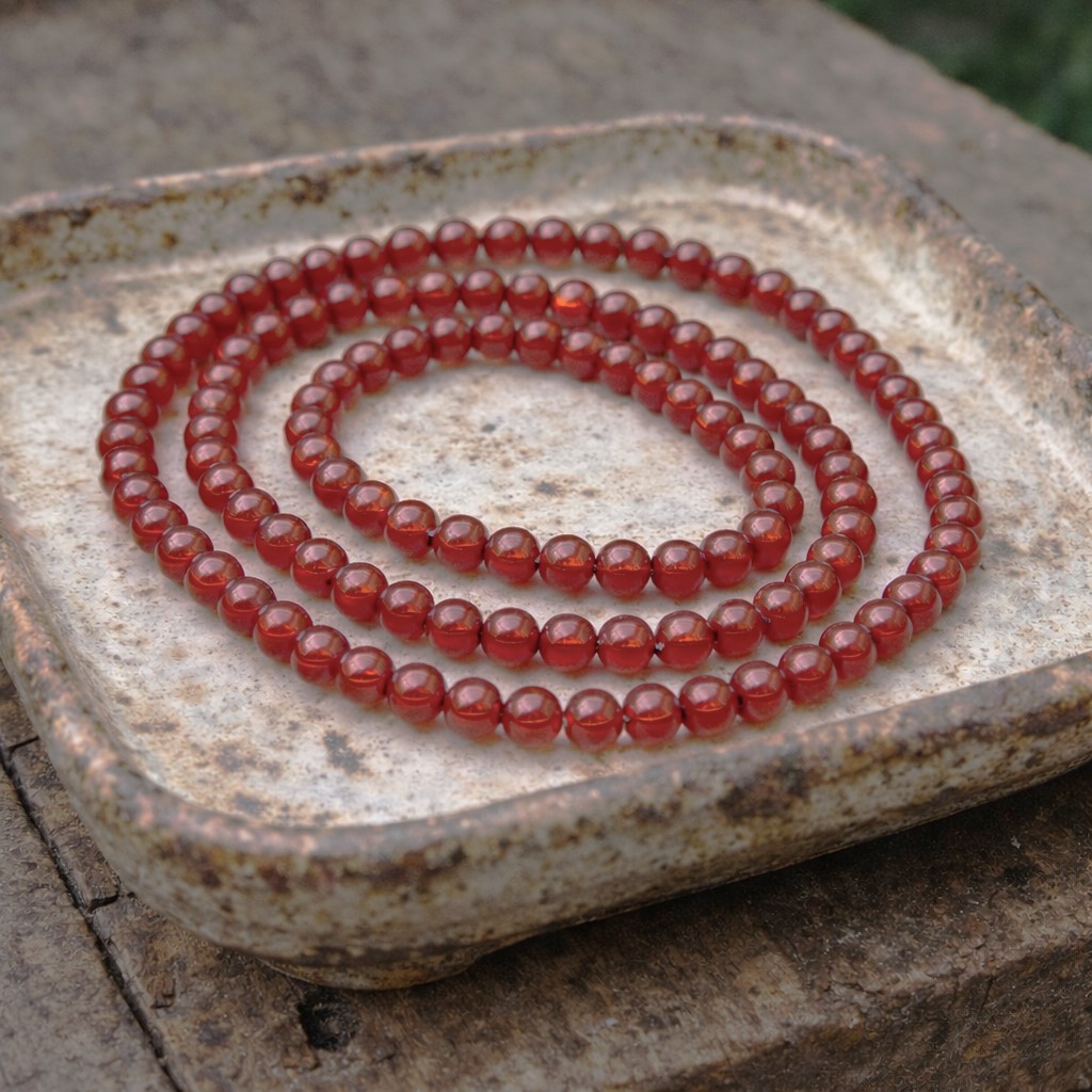 Karneol Perlenstrang 6 - 6,4 mm (ca. 62 Perlen / ca. 38 cm Länge)