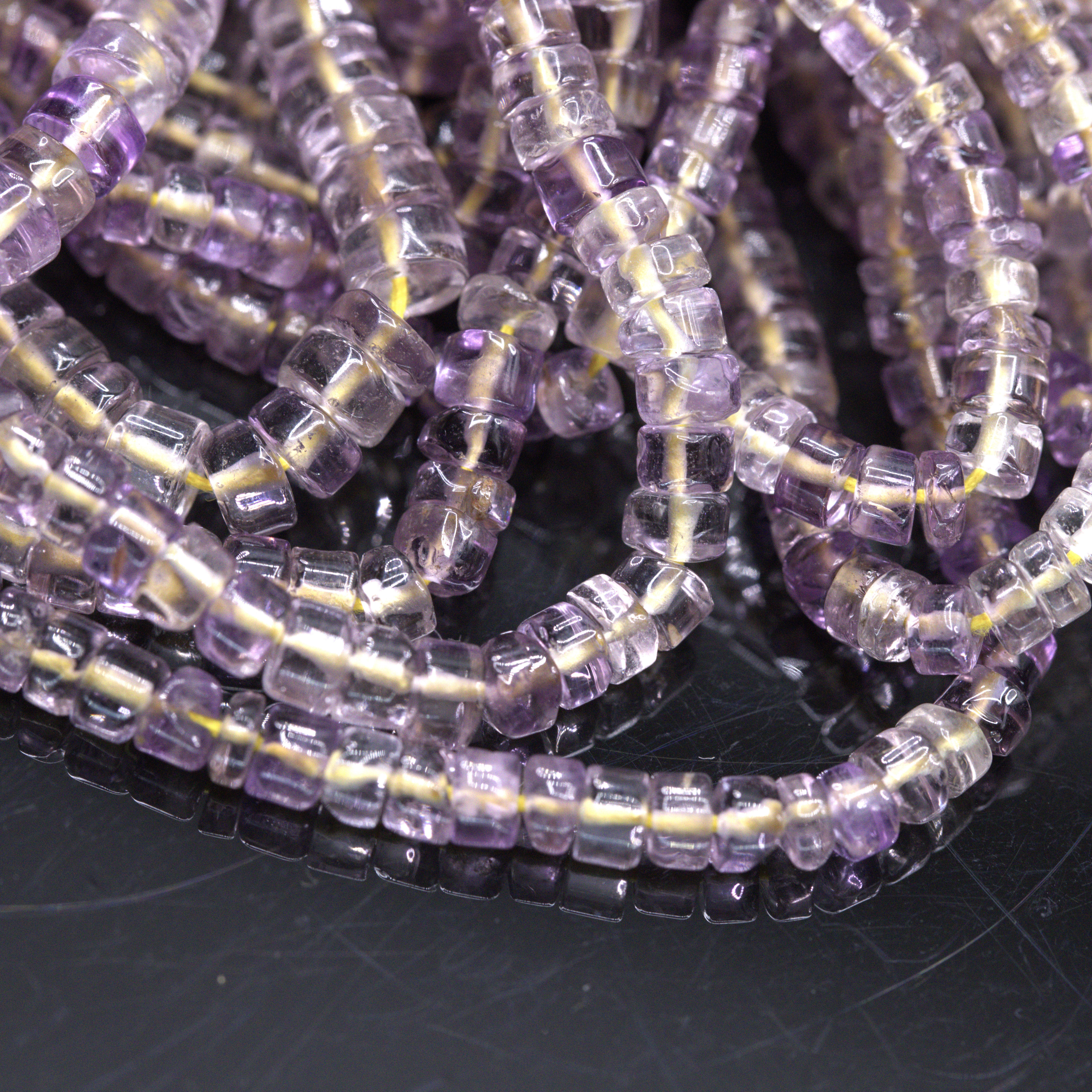 Sehr heller Amethyst Perlenstrang 4-5 x 3-4 mm unregelmäßige Rondelle (ca. 36 cm Länge)