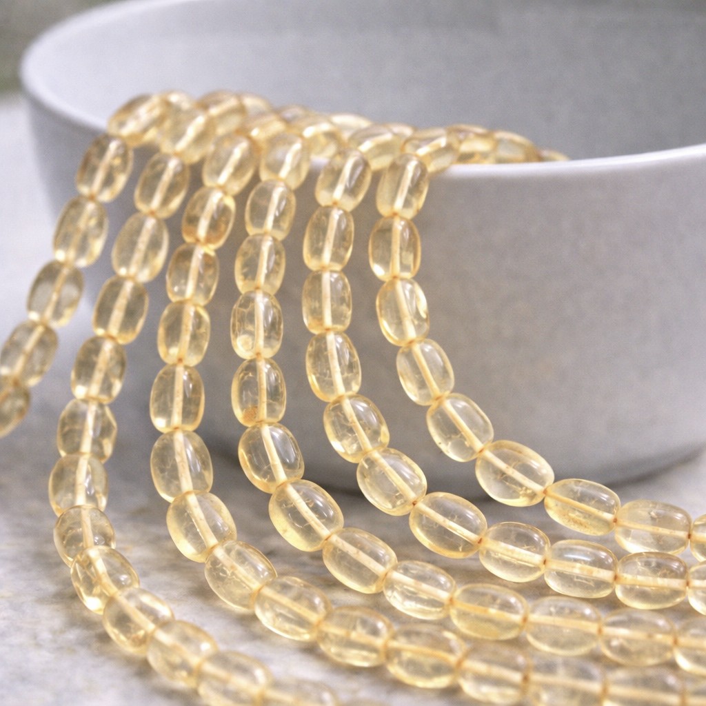 Citrin Perlenstrang 9-11 x 6-7 x 2-3 mm unregelmäßige ovale Perlen (ca. 34 cm Länge)