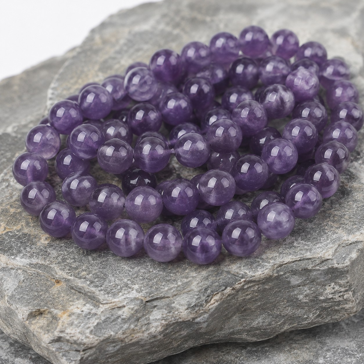 Amethyst Perlenstrang 6 - 6,5 mm Klasse AB rund (ca. 66 Perlen / ca. 38 cm Länge)