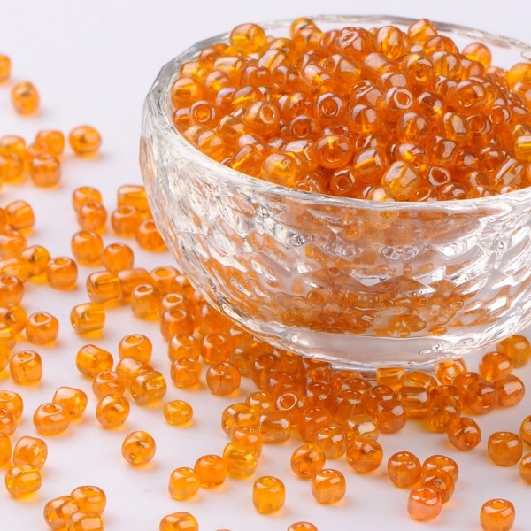 50 Gramm Runde Rocailles transparent orange